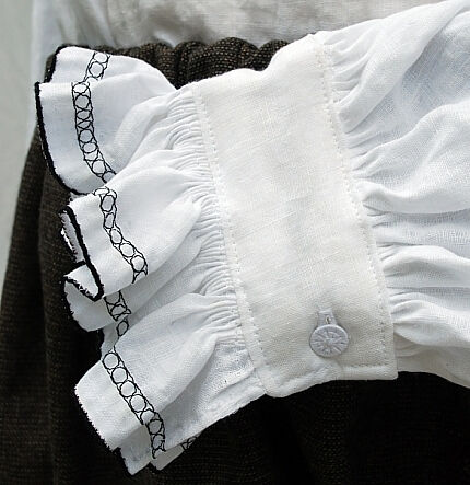 Shirt Cuff Embroidery and Pleating Detail